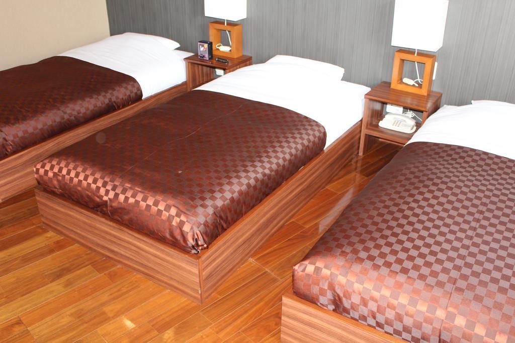 Hotel Saika Fujisawa Quarto foto