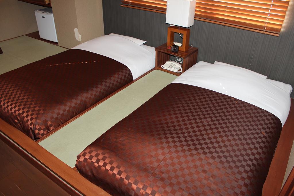 Hotel Saika Fujisawa Quarto foto