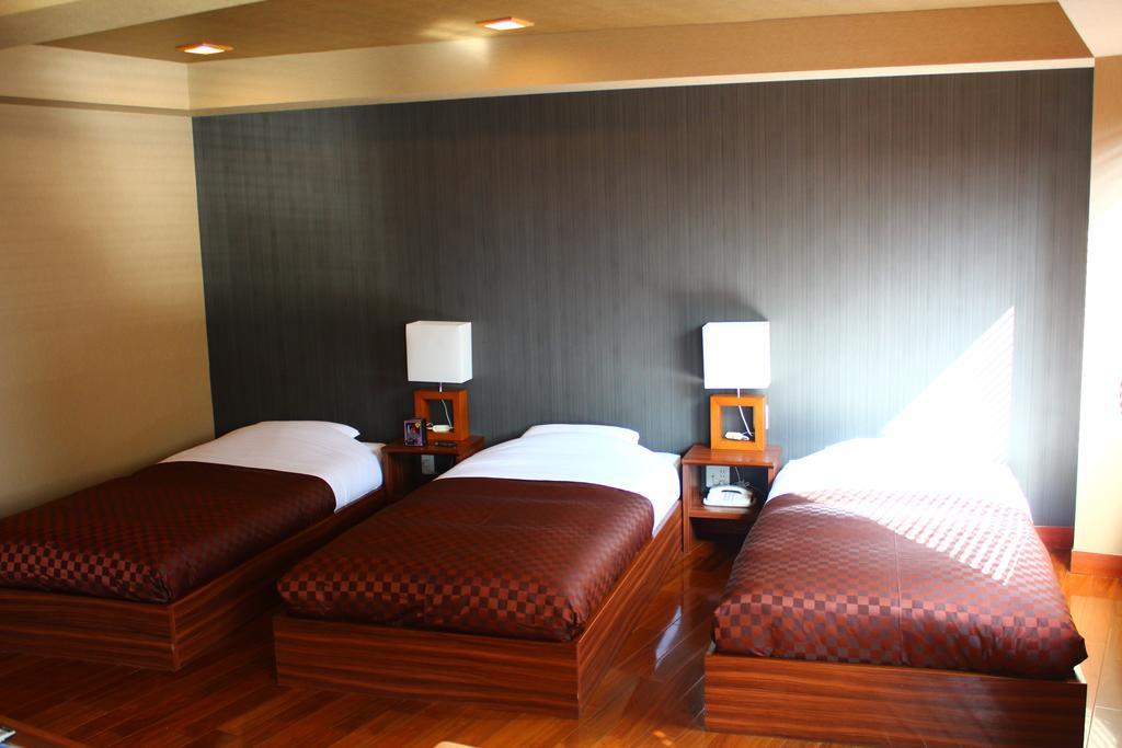 Hotel Saika Fujisawa Quarto foto