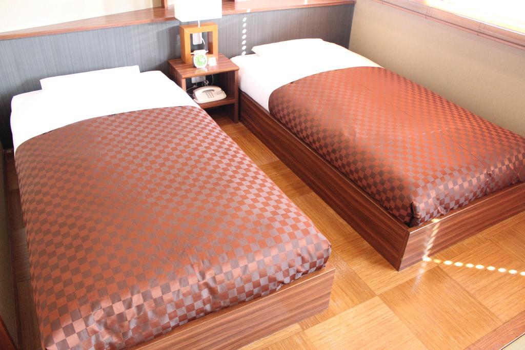 Hotel Saika Fujisawa Quarto foto
